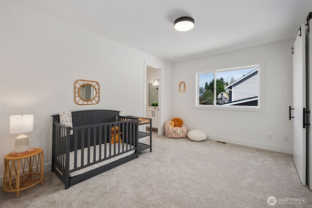 1002 N 31st St, Renton, WA 98056 - bedroom featuring carpet floors, a barn door, and a crib