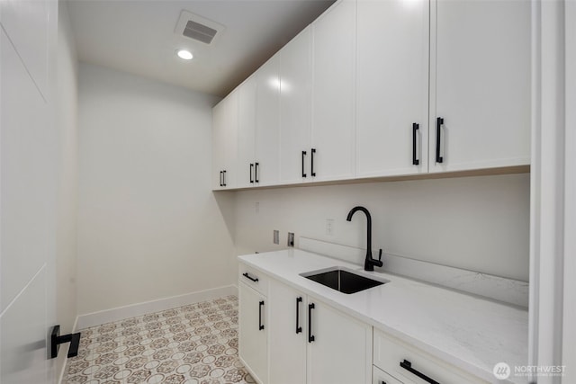 1002 N 31st St, Renton, WA 98056 - washroom featuring baseboards, cabinet space, recessed lighting, and washer hookup