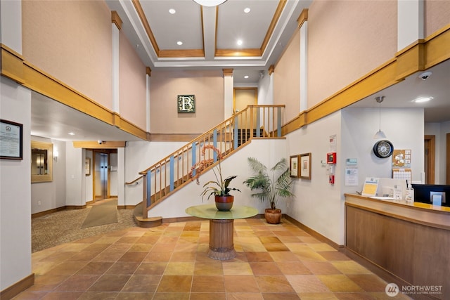 1545 NW 57th St Unit 220, Seattle, WA 98107 - foyer entrance featuring a high ceiling, recessed lighting, baseboards, and stairway