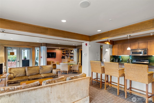 1545 NW 57th St Unit 220, Seattle, WA 98107 - living area with recessed lighting and light colored carpet