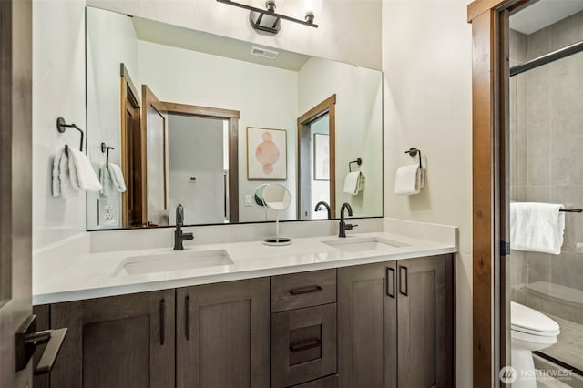 1450 Creekside Rd, Cle Elum, WA 98922 - bathroom with double vanity, toilet, and a stall shower