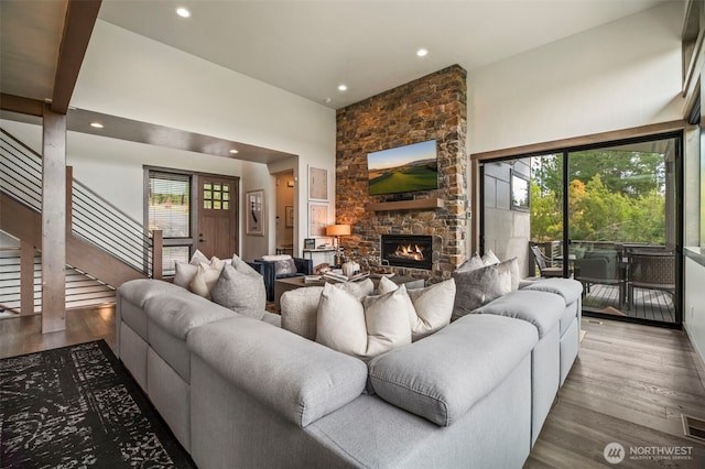 1450 Creekside Rd, Cle Elum, WA 98922 - living area with stairway, healthy amount of natural light, recessed lighting, a stone fireplace, and wood finished floors