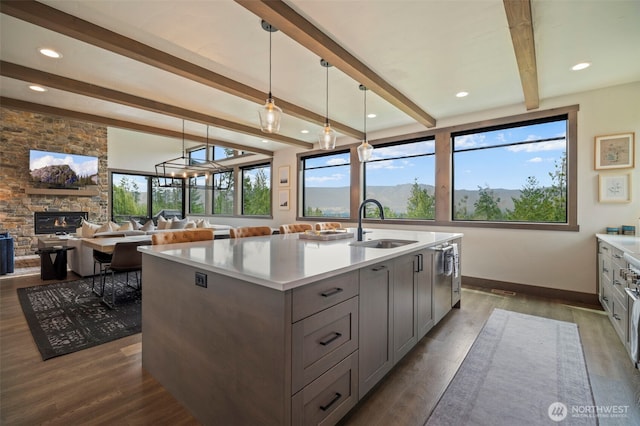 1450 Creekside Rd, Cle Elum, WA 98922 - kitchen featuring a sink, gray cabinets, beam ceiling, light countertops, and a center island with sink