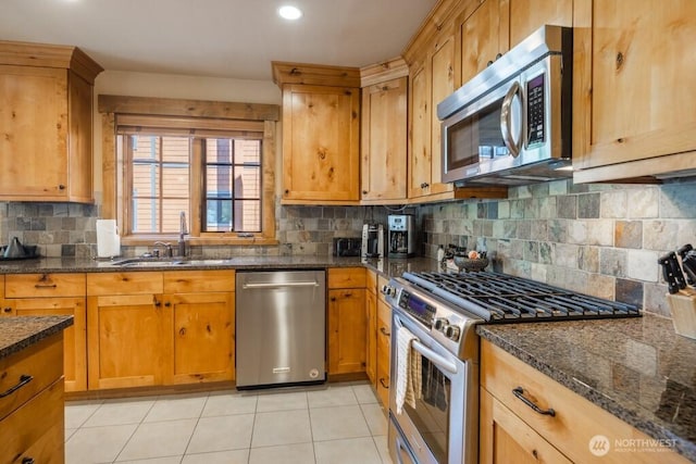 3770 Suncadia Trl Unit 110, Cle Elum, WA 98922 - kitchen featuring stainless steel appliances, a sink, decorative backsplash, dark stone counters, and recessed lighting