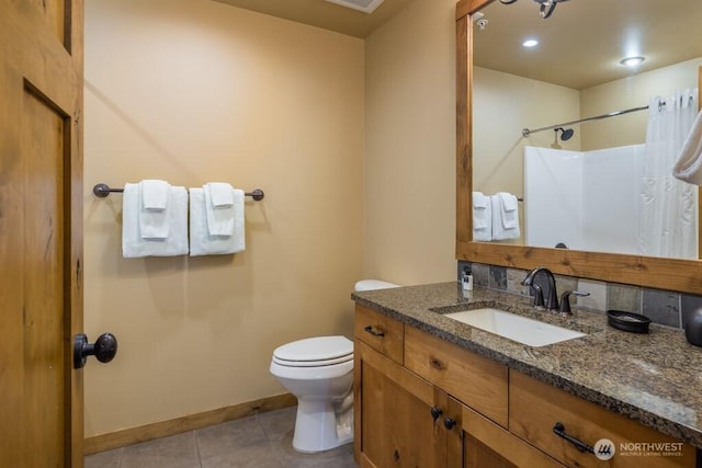 3770 Suncadia Trl Unit 110, Cle Elum, WA 98922 - bathroom with vanity, toilet, tile patterned flooring, curtained shower, and baseboards
