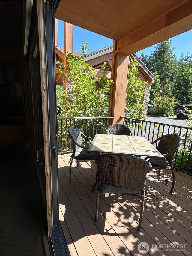 3770 Suncadia Trl Unit 110, Cle Elum, WA 98922 - wooden terrace with outdoor dining space