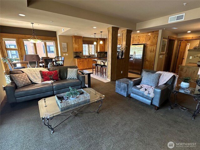 3770 Suncadia Trl Unit 110, Cle Elum, WA 98922 - living room with dark carpet, recessed lighting, and decorative columns