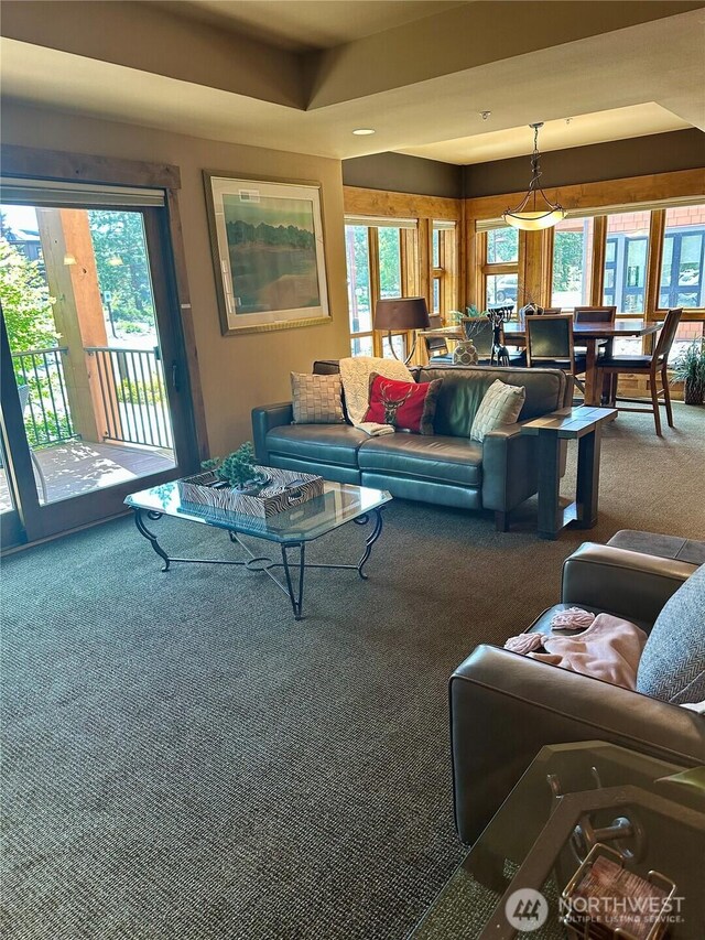 3770 Suncadia Trl Unit 110, Cle Elum, WA 98922 - carpeted living area featuring plenty of natural light