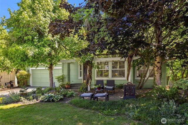 14566 86th Pl NE, Kenmore, WA 98028 - view of property hidden behind natural elements featuring an attached garage, dirt driveway, and a front lawn
