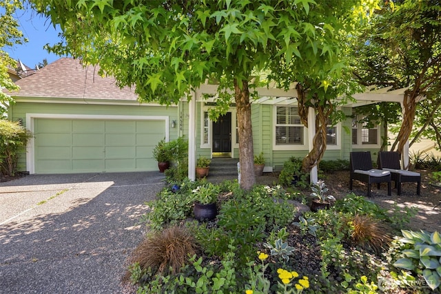 14566 86th Pl NE, Kenmore, WA 98028 - obstructed view of property featuring a garage, driveway, and roof with shingles