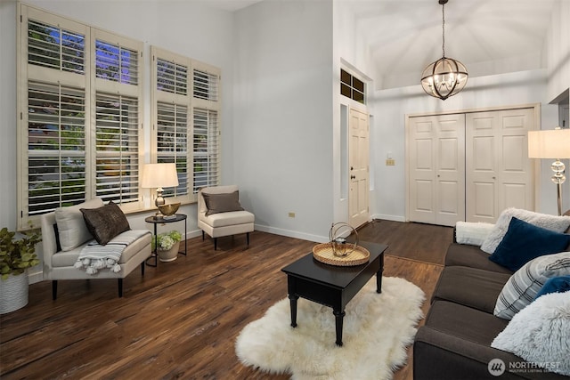 14566 86th Pl NE, Kenmore, WA 98028 - living area featuring a chandelier, wood finished floors, baseboards, and high vaulted ceiling