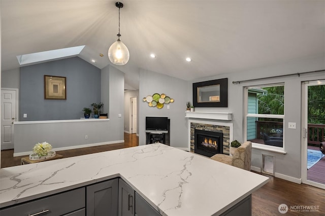 14566 86th Pl NE, Kenmore, WA 98028 - kitchen with vaulted ceiling, gray cabinetry, dark wood finished floors, open floor plan, and a stone fireplace
