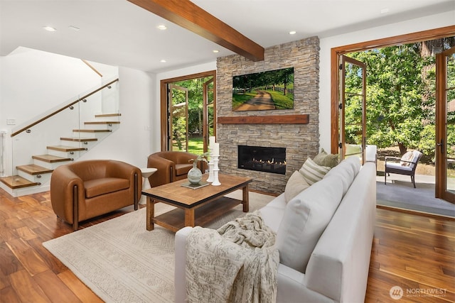 5619 89th Ave SE, Mercer Island, WA 98040 - living room featuring wood finished floors, stairs, beamed ceiling, a stone fireplace, and recessed lighting