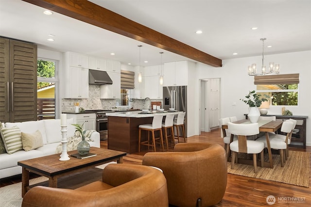 5619 89th Ave SE, Mercer Island, WA 98040 - living room with recessed lighting, dark wood finished floors, beamed ceiling, and a chandelier