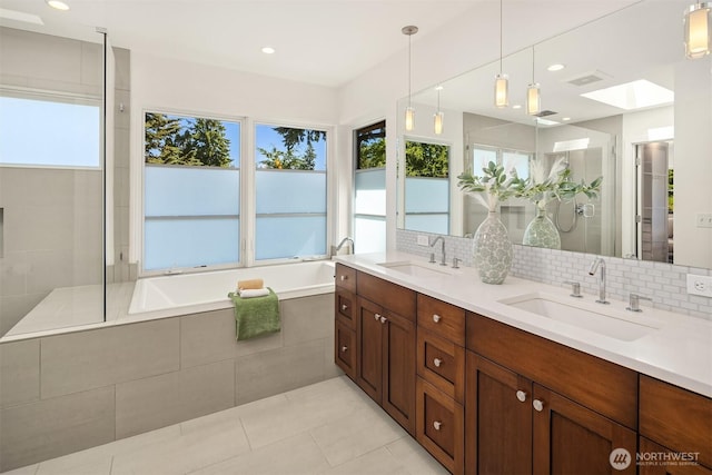 5619 89th Ave SE, Mercer Island, WA 98040 - bathroom featuring a garden tub, double vanity, a tile shower, decorative backsplash, and recessed lighting