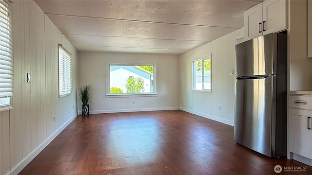 42010 SE N Bend Way Unit 29, North Bend, WA 98045 - unfurnished dining area with dark wood finished floors and wood walls