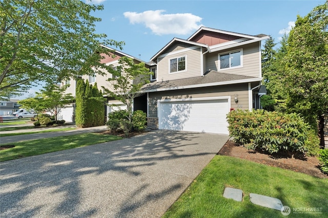 4118 148th St SW Unit A4, Lynnwood, WA 98087 - craftsman-style house with concrete driveway, a garage, and roof with shingles