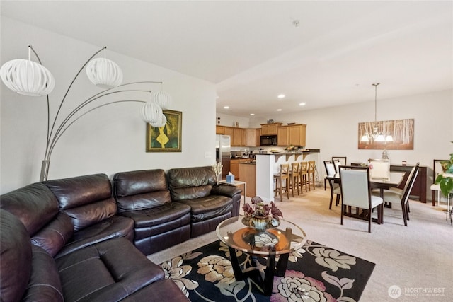 4118 148th St SW Unit A4, Lynnwood, WA 98087 - living area with light carpet, a chandelier, and recessed lighting