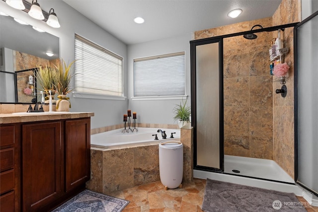 413 Boylson St, Moses Lake, WA 98837 - full bathroom featuring a stall shower, vanity, a bath, stone finish floors, and recessed lighting