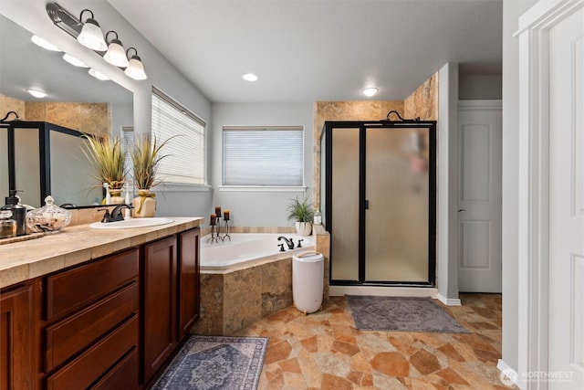 413 Boylson St, Moses Lake, WA 98837 - bathroom with a shower stall, vanity, a bath, and stone finish flooring