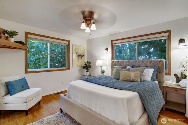 8708 11th St NE, Lake Stevens, WA 98258 - bedroom featuring wood finished floors, baseboards, and a ceiling fan