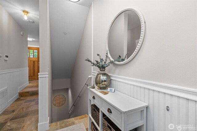 31 Etruria St Unit B, Seattle, WA 98109 - bathroom with a wainscoted wall, stone finish floors, and a decorative wall