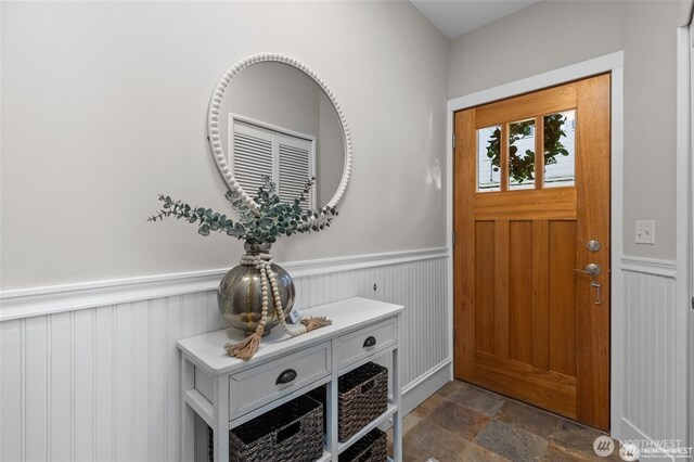 31 Etruria St Unit B, Seattle, WA 98109 - foyer entrance featuring dark stone finish floors and wainscoting