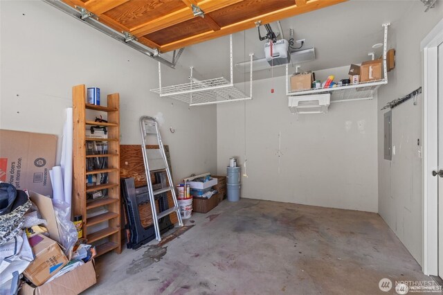 31 Etruria St Unit B, Seattle, WA 98109 - garage featuring a garage door opener and electric panel