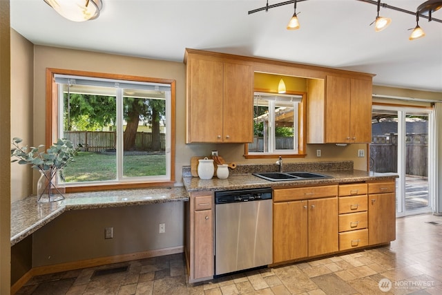 29922 5th Ave SW, Federal Way, WA 98023 - kitchen featuring stainless steel dishwasher, a sink, plenty of natural light, and stone tile floors