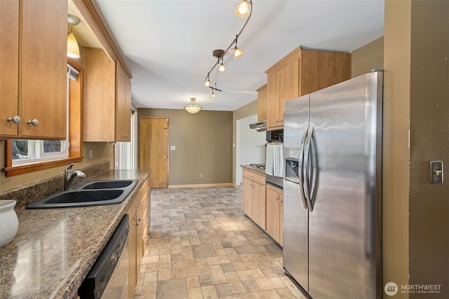 29922 5th Ave SW, Federal Way, WA 98023 - kitchen with appliances with stainless steel finishes, a sink, baseboards, light stone finish flooring, and brown cabinetry