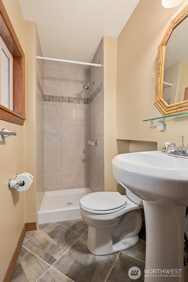29922 5th Ave SW, Federal Way, WA 98023 - bathroom with toilet, a tile shower, and tile patterned floors