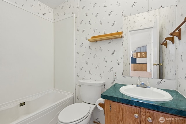3371 SE Bielmeier Rd Unit 87, Port Orchard, WA 98367 - bathroom with wallpapered walls, vanity, toilet, and shower / bath combination