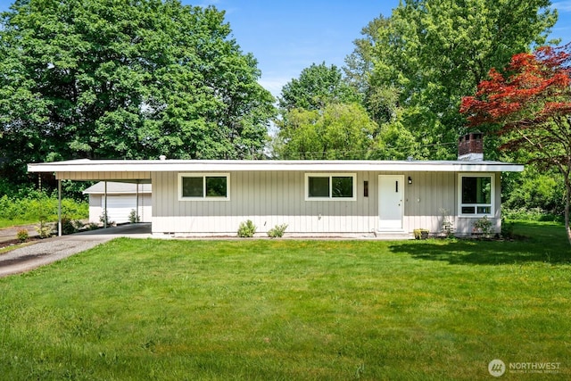 924 1st St, Sultan, WA 98294 - ranch-style home featuring a chimney, a front yard, asphalt driveway, and a carport