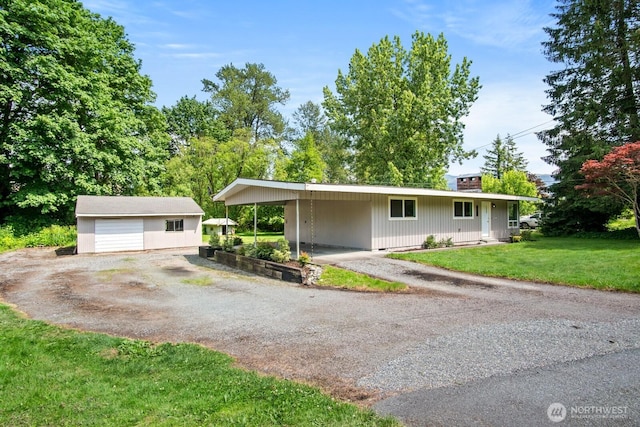 924 1st St, Sultan, WA 98294 - ranch-style home featuring a front yard, a carport, an outbuilding, and driveway