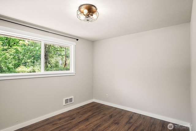 924 1st St, Sultan, WA 98294 - spare room with baseboards and dark wood-type flooring