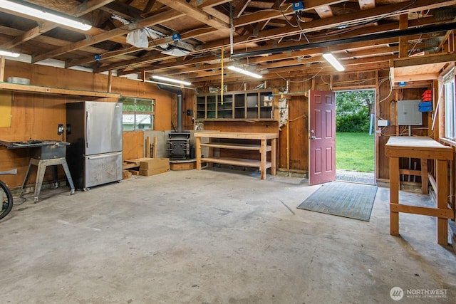 924 1st St, Sultan, WA 98294 - garage featuring freestanding refrigerator and a workshop area