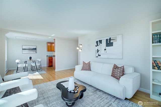 919 2nd Ave W Unit 601, Seattle, WA 98119 - living room featuring light wood-type flooring and baseboards