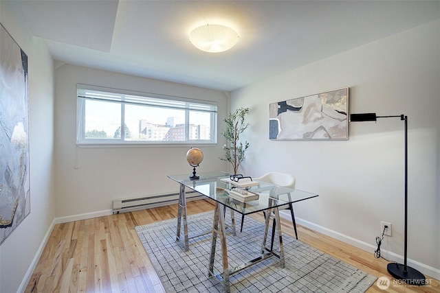 919 2nd Ave W Unit 601, Seattle, WA 98119 - office area featuring baseboard heating, light wood-style floors, and baseboards