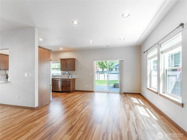 2452 NW Columbia Ave Unit 25, East Wenatchee, WA 98802 - unfurnished living room with recessed lighting, light wood-type flooring, and baseboards