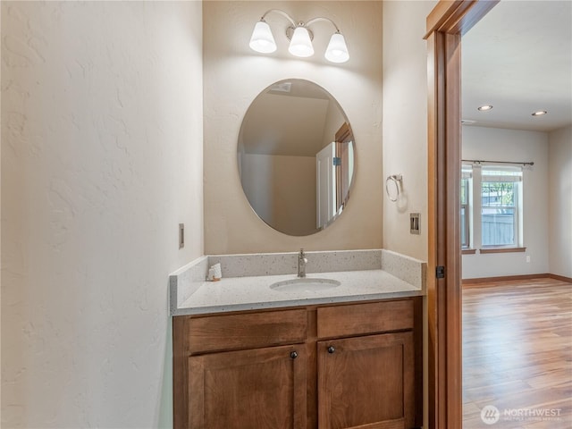 2452 NW Columbia Ave Unit 25, East Wenatchee, WA 98802 - bathroom with vanity, wood finished floors, and recessed lighting