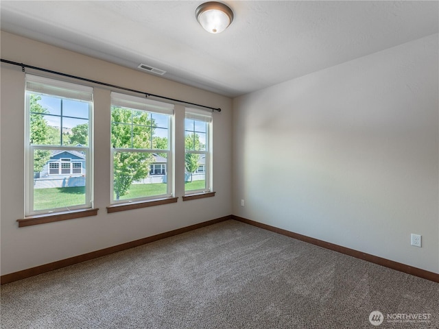 2452 NW Columbia Ave Unit 25, East Wenatchee, WA 98802 - carpeted empty room with baseboards