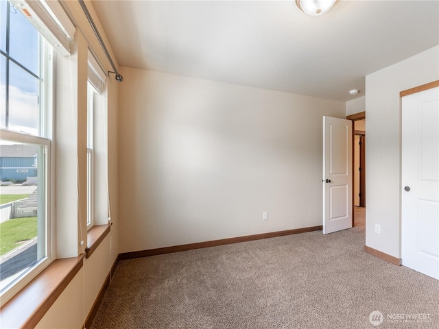 2452 NW Columbia Ave Unit 25, East Wenatchee, WA 98802 - unfurnished bedroom with light colored carpet and baseboards