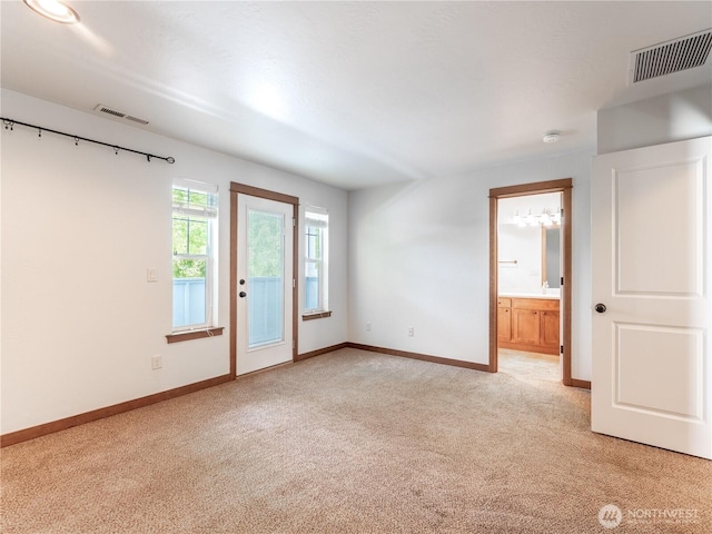 2452 NW Columbia Ave Unit 25, East Wenatchee, WA 98802 - unfurnished room featuring light colored carpet, baseboards, and a smoke detector