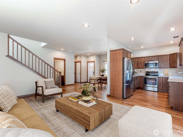 2452 NW Columbia Ave Unit 25, East Wenatchee, WA 98802 - living area featuring stairs, recessed lighting, and light wood-type flooring