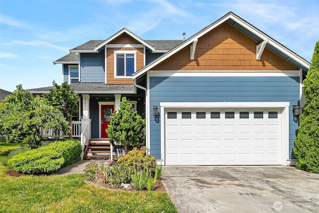 4155 Aurora Loop, Bellingham, WA 98226 - view of front of property with covered porch, concrete driveway, a shingled roof, and a garage