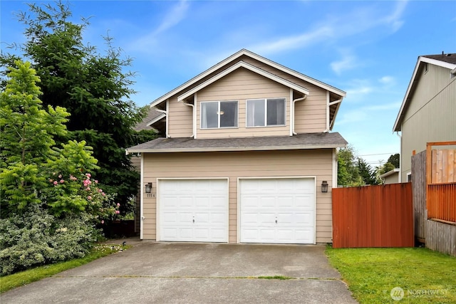 1114 E 57th St, Tacoma, WA 98404 - view of front of home featuring an attached garage, concrete driveway, and a shingled roof