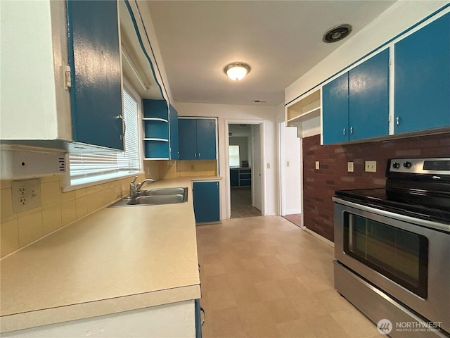 425 Henry St, Shelton, WA 98584 - kitchen with electric range, blue cabinets, a sink, and open shelves
