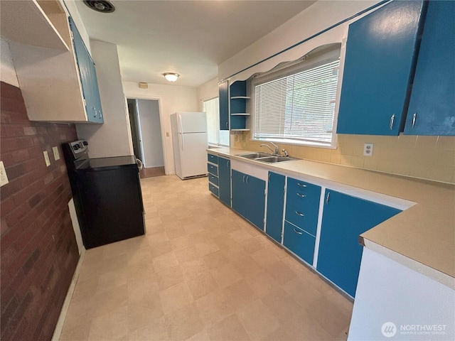 425 Henry St, Shelton, WA 98584 - kitchen featuring blue cabinetry, freestanding refrigerator, stainless steel electric range oven, a sink, and open shelves