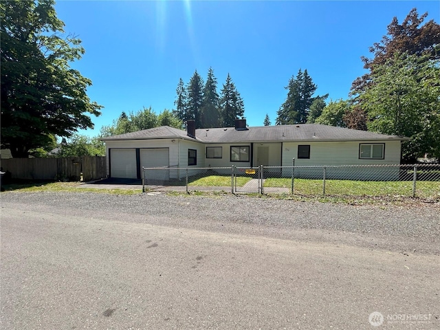 425 Henry St, Shelton, WA 98584 - ranch-style home with a garage, a chimney, and driveway