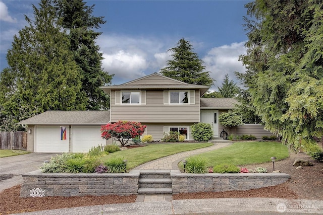 13303 53rd Ave SE, Everett, WA 98208 - tri-level home with driveway, an attached garage, and a shingled roof